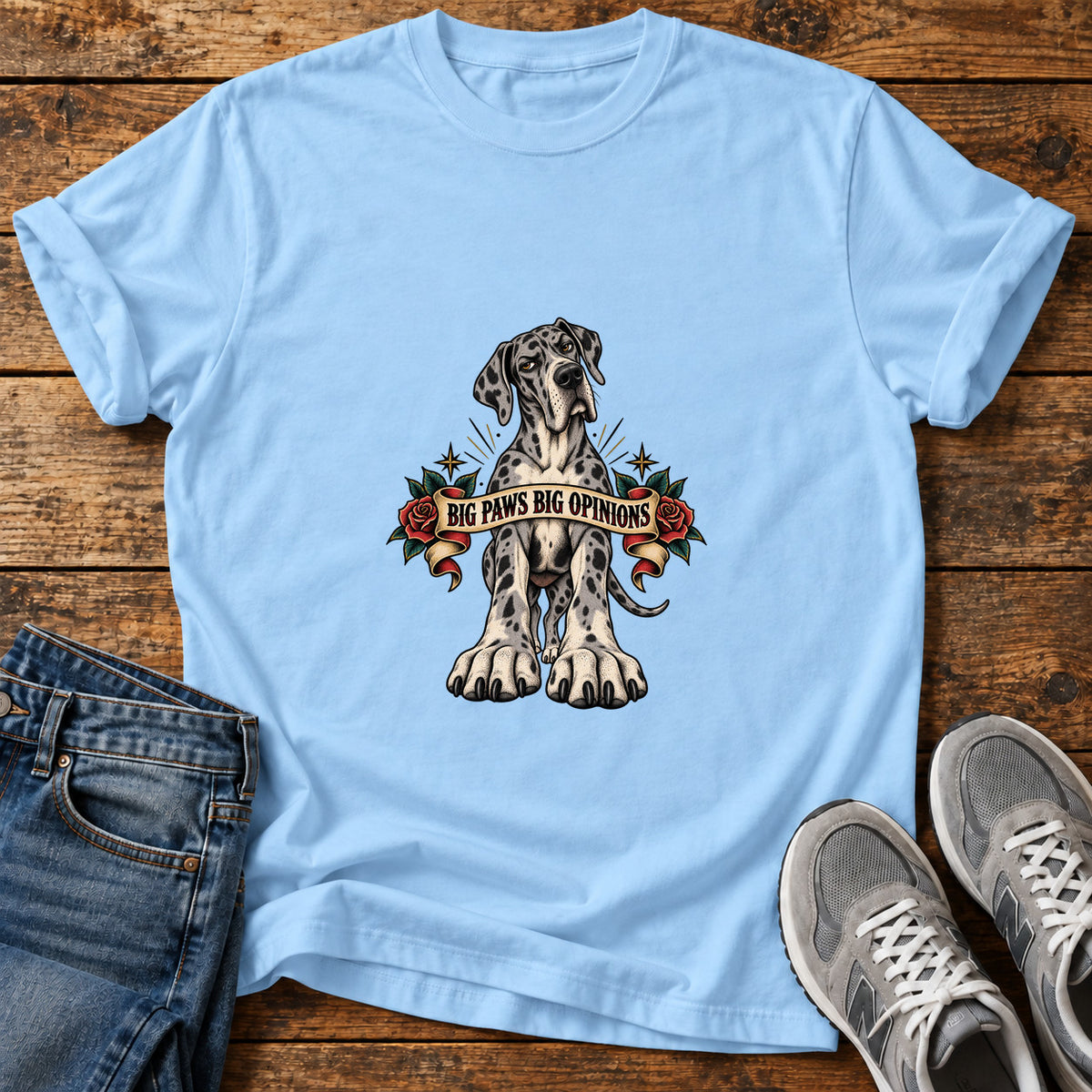 Big Paws Opinions Great Dane graphic T-shirt in Light Blue, shown on a flat-lay shirt mockup