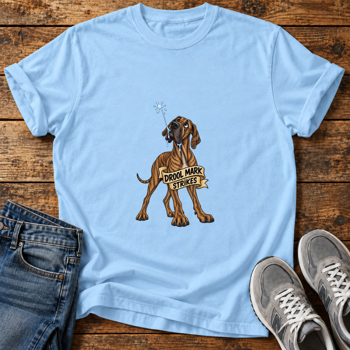 Drool Mark Strikes Great Dane graphic T-shirt in Light Blue, shown on a flat-lay shirt mockup
