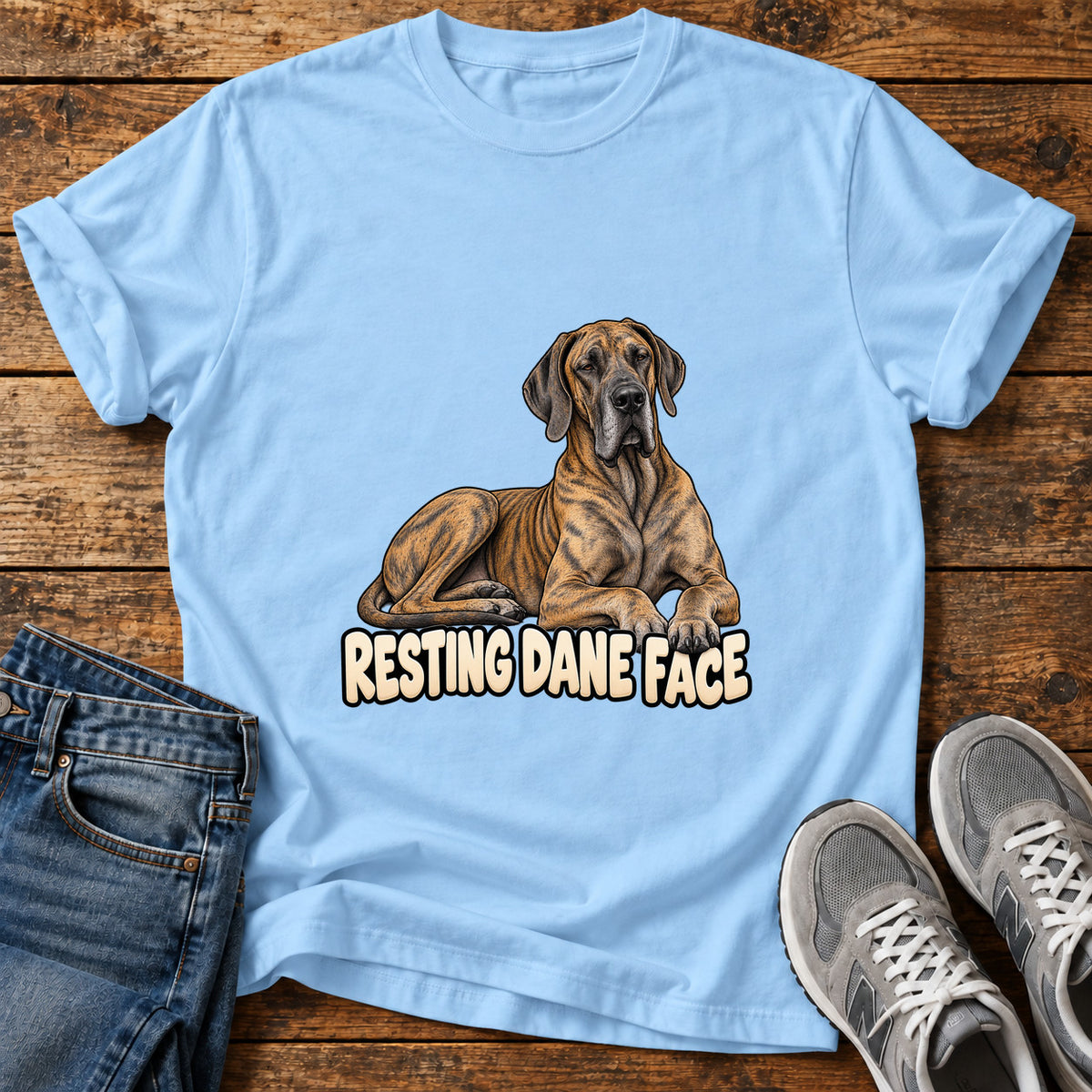 Resting Dane Face Great Dane graphic T-shirt in Light Blue, shown on a flat-lay shirt mockup