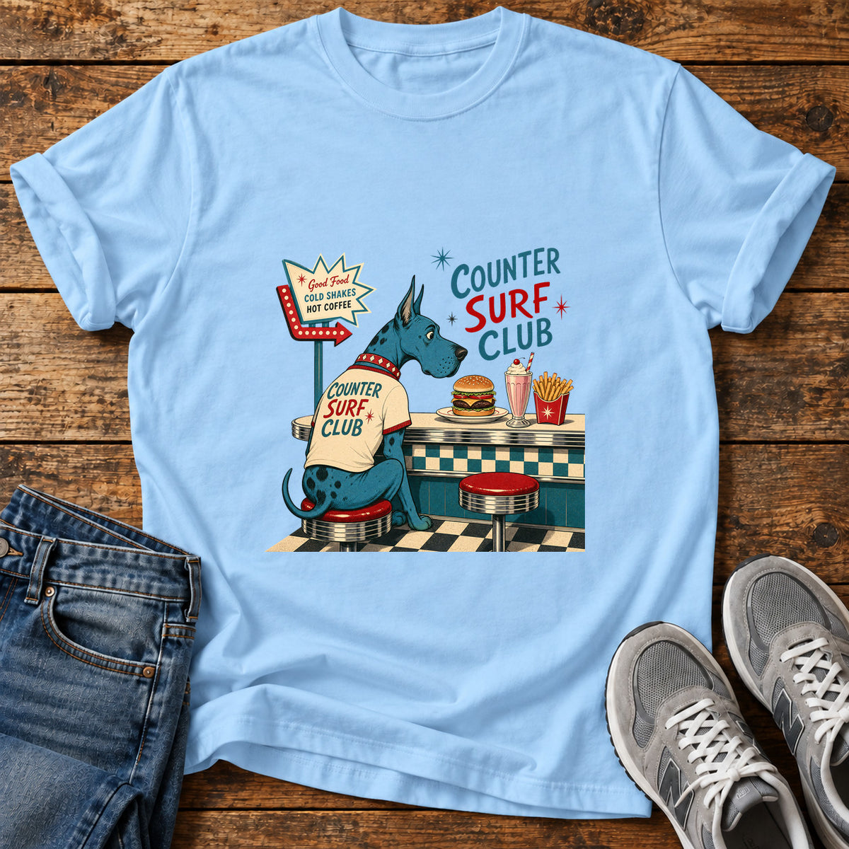 Counter Surf Club Great Dane graphic T-shirt in Light Blue, shown on a flat-lay shirt mockup