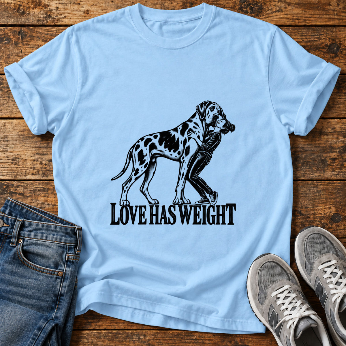 Love Has Weight Great Dane graphic T-shirt in Light Blue, shown on a flat-lay shirt mockup