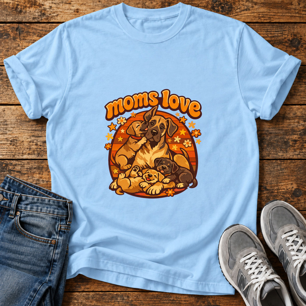 Moms Love Great Dane graphic T-shirt in Light Blue, shown on a flat-lay shirt mockup