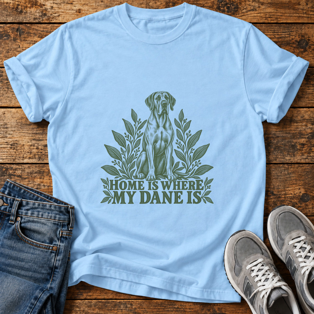 Dane Home Vibes Great Dane graphic T-shirt in Light Blue, shown on a flat-lay shirt mockup