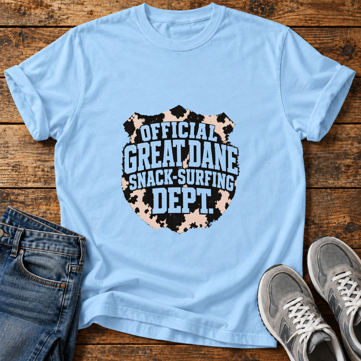 Snack-Surfing Dept Great Dane graphic T-shirt in Light Blue, shown on a flat-lay shirt mockup