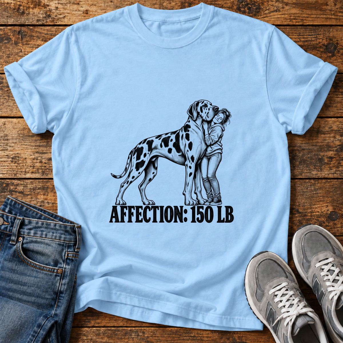 Affection 150 lb Great Dane graphic T-shirt in Light Blue, shown on a flat-lay shirt mockup