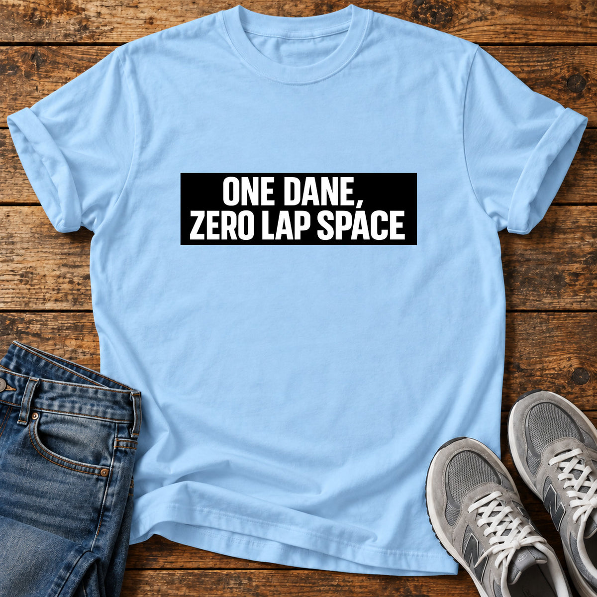 One Dane Zero Great Dane graphic T-shirt in Light Blue, shown on a flat-lay shirt mockup