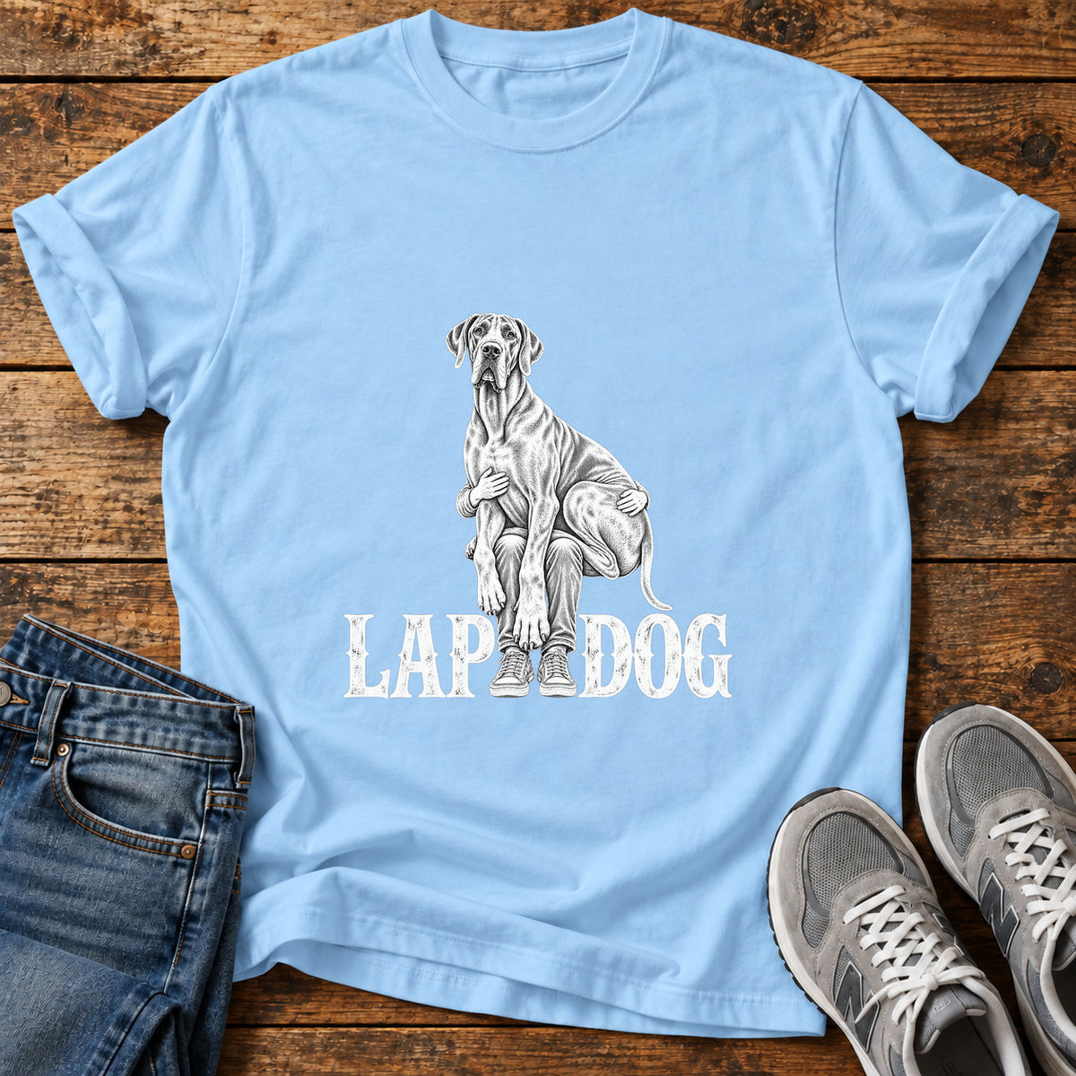 Lap Dog Great Dane graphic T-shirt in Light Blue, shown on a flat-lay shirt mockup