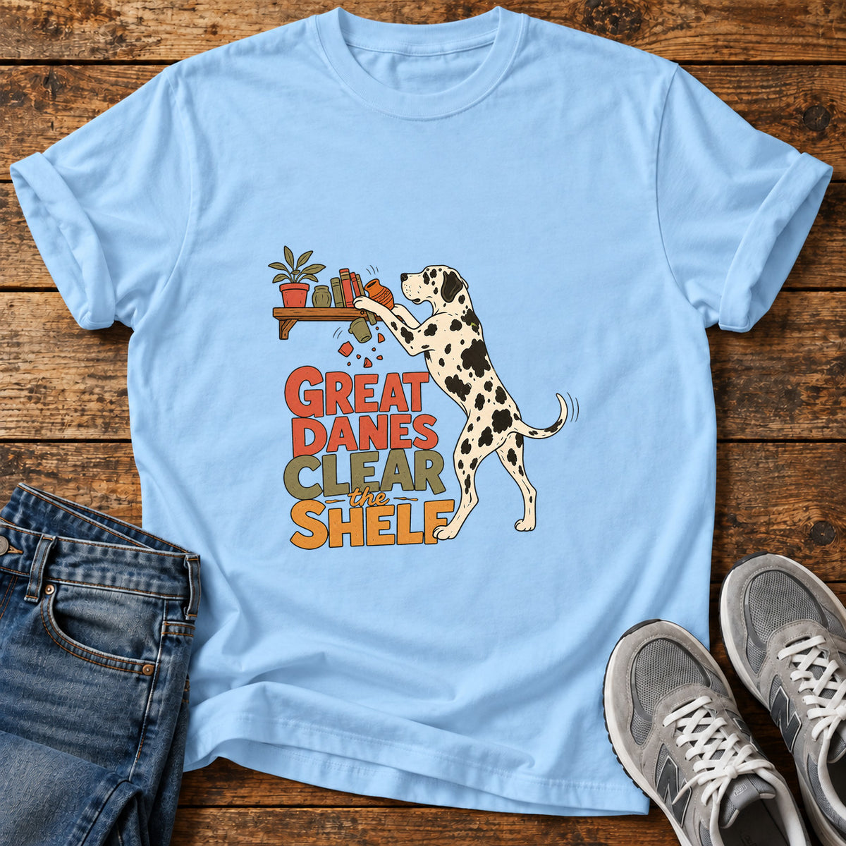 Great Danes Shelf graphic T-shirt in Light Blue, shown on a flat-lay shirt mockup