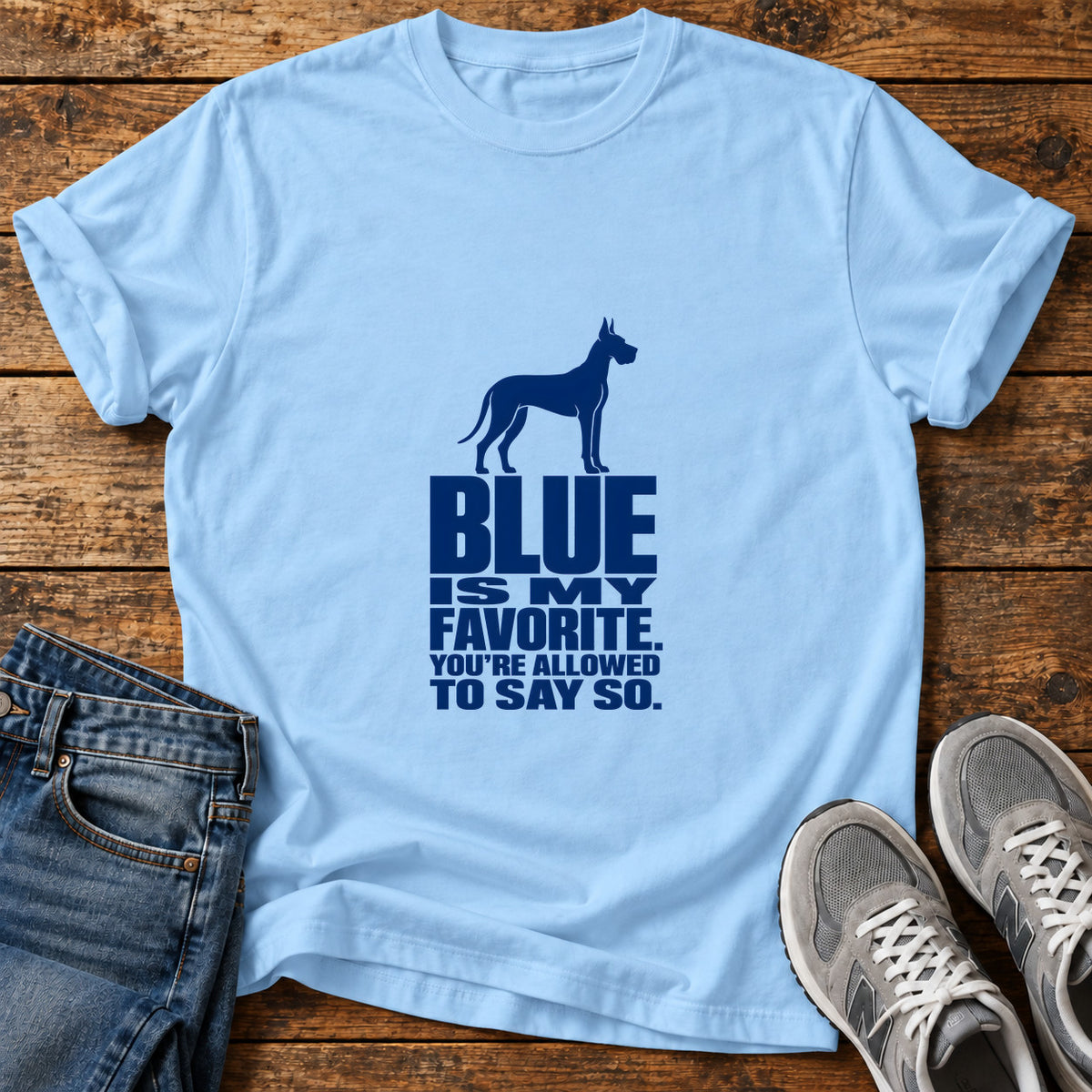 Blue Favorite Attire Great Dane graphic T-shirt in Light Blue, shown on a flat-lay shirt mockup