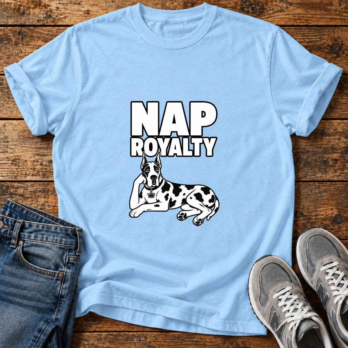 Nap Royalty Great Dane graphic T-shirt in Light Blue, shown on a flat-lay shirt mockup