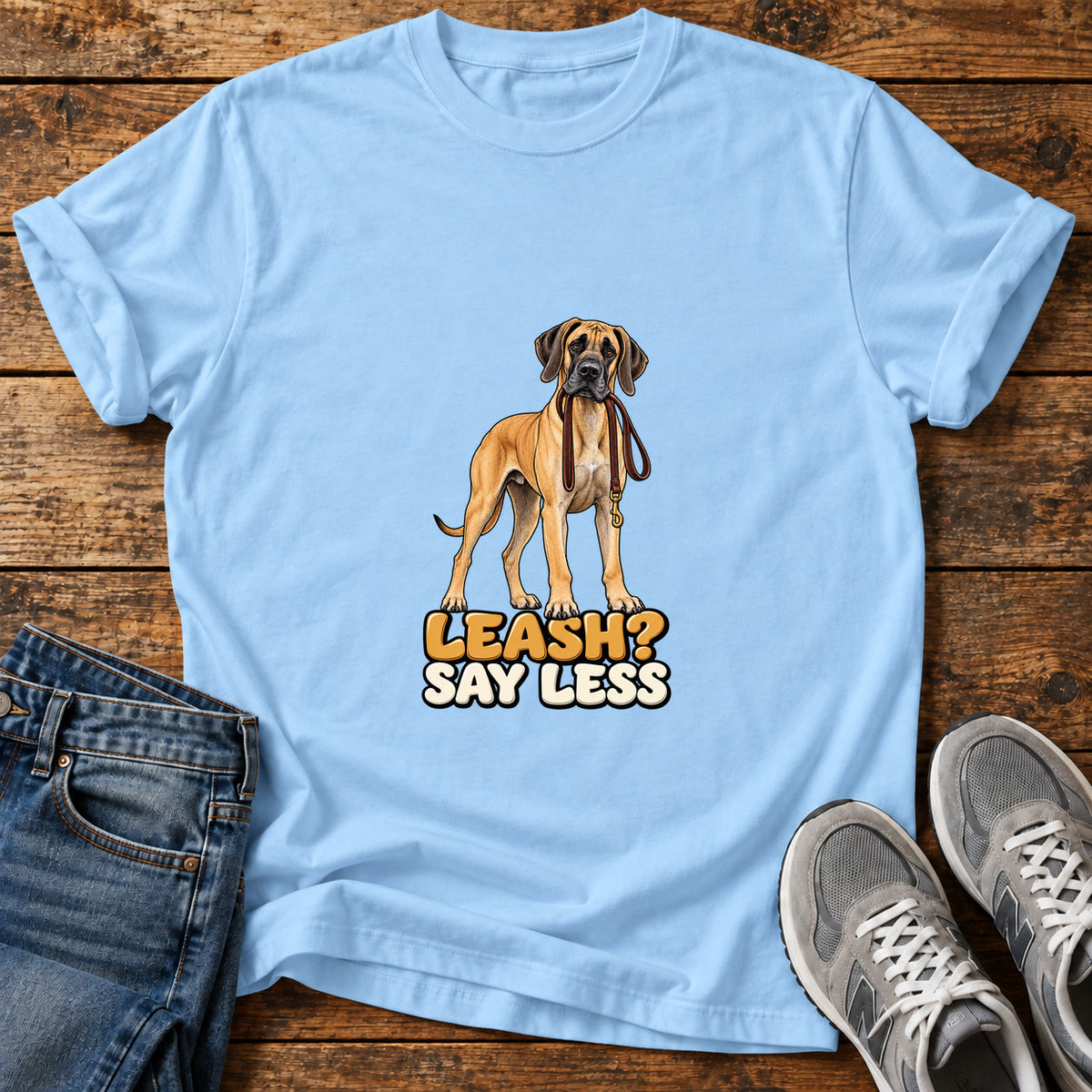 Leash Say Less Great Dane graphic T-shirt in Light Blue, shown on a flat-lay shirt mockup