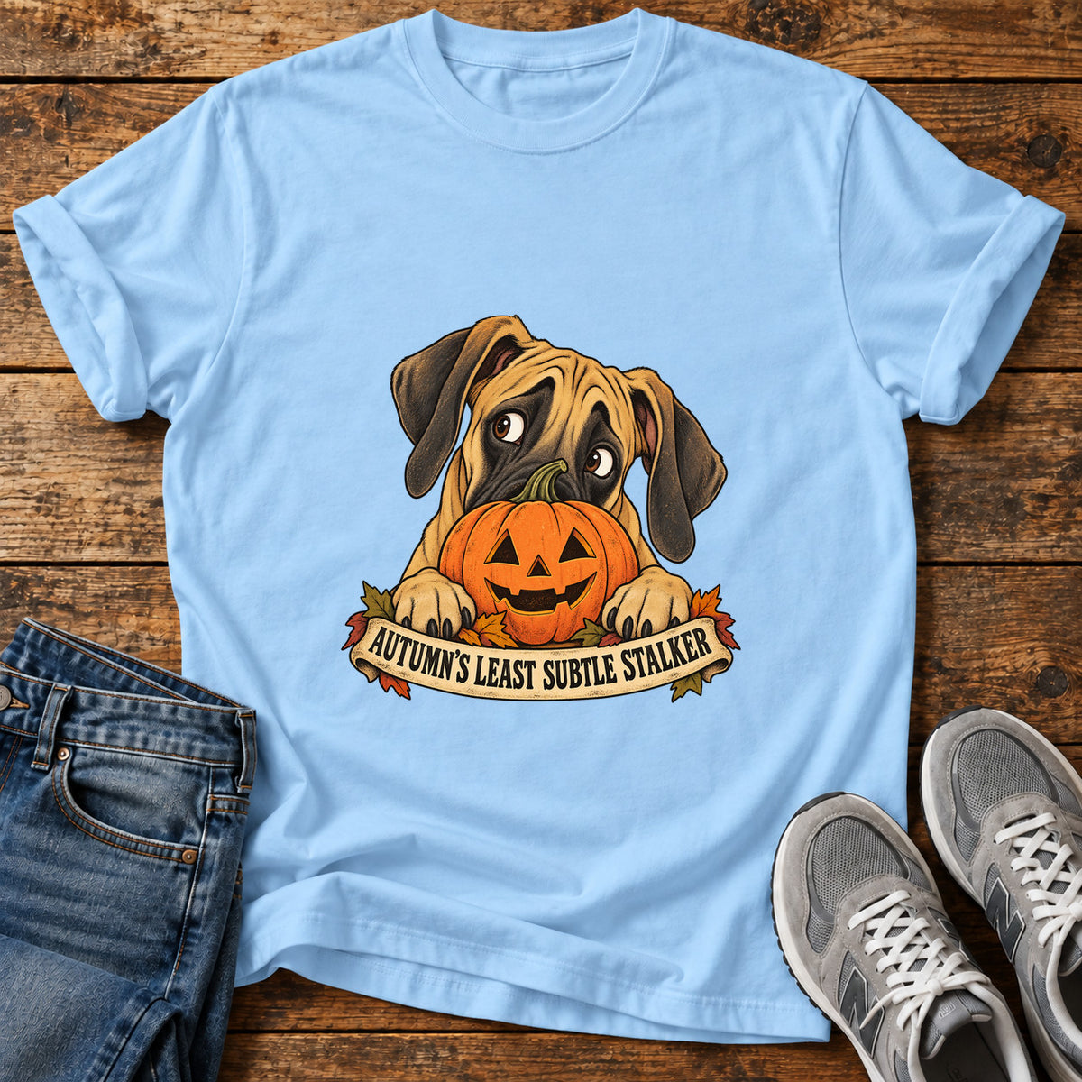 Autumn's Stalker Great Dane graphic T-shirt in Light Blue, shown on a flat-lay shirt mockup