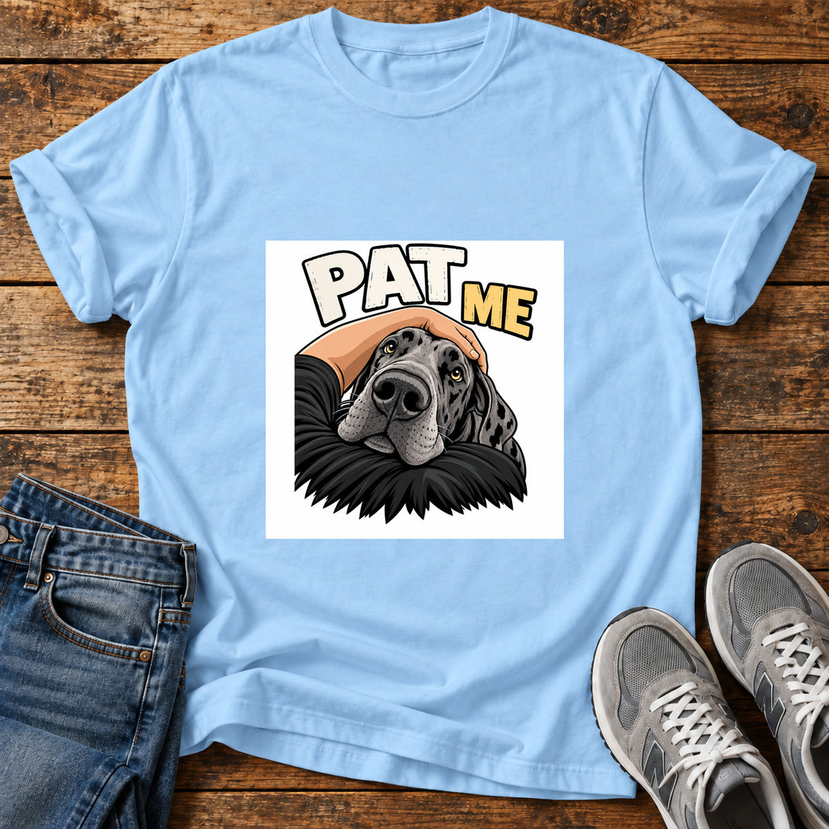 Pat Me Great Dane graphic T-shirt in Light Blue, shown on a flat-lay shirt mockup