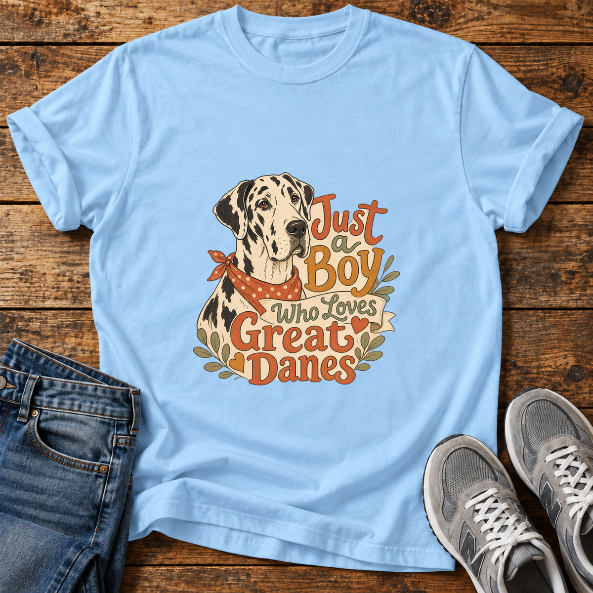 Just a Boy Great Dane graphic T-shirt in Light Blue, shown on a flat-lay shirt mockup