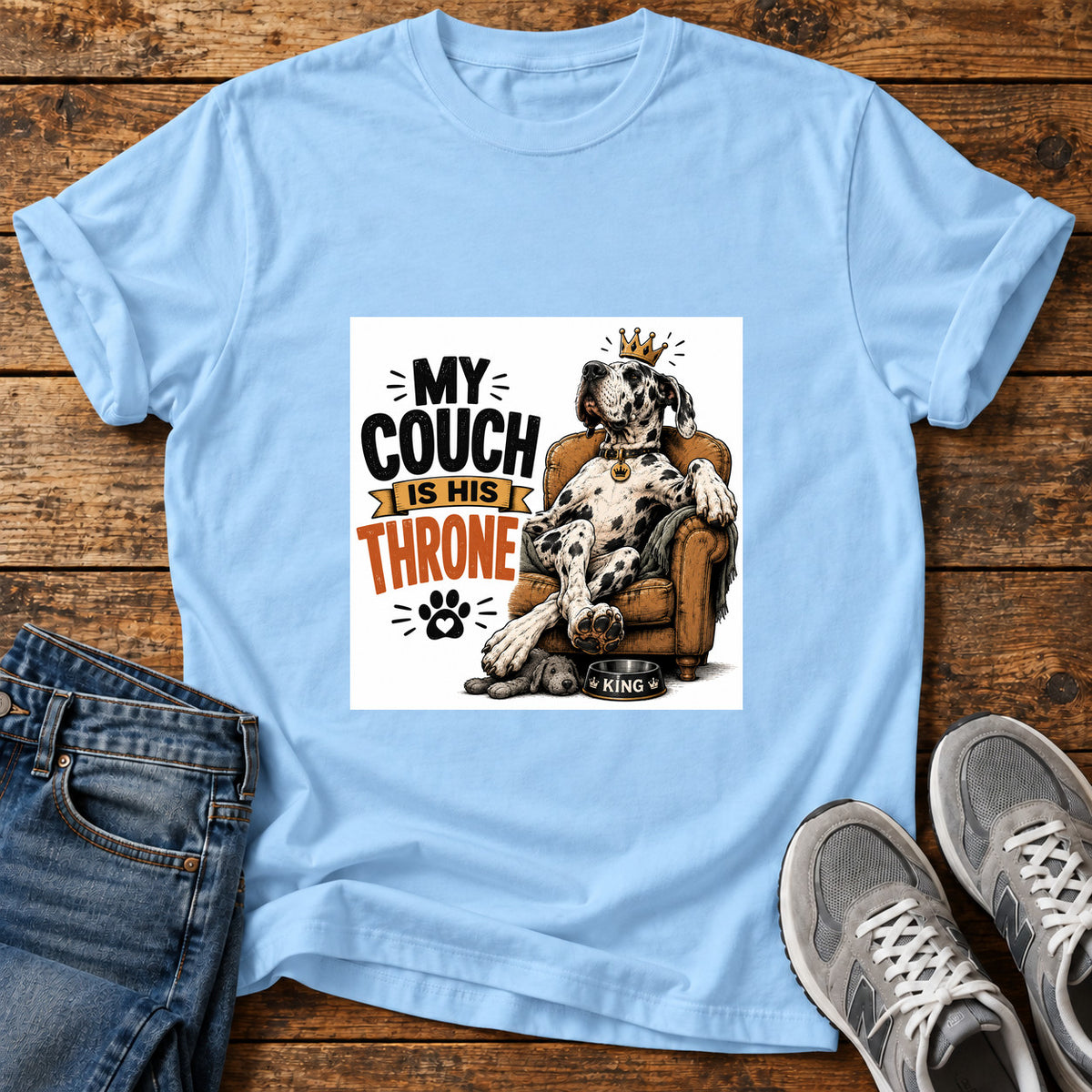 Couch Throne Great Dane graphic T-shirt in Light Blue, shown on a flat-lay shirt mockup