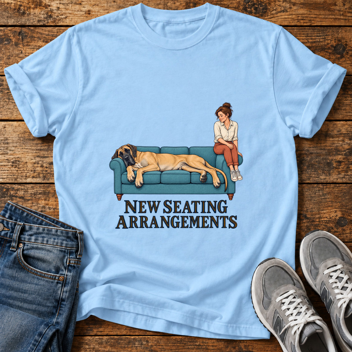 New Seating Arrangements Great Dane graphic T-shirt in Light Blue, shown on a flat-lay shirt mockup