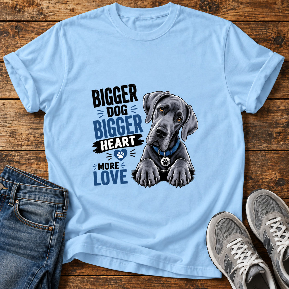 Bigger Heart Great Dane graphic T-shirt in Light Blue, shown on a flat-lay shirt mockup