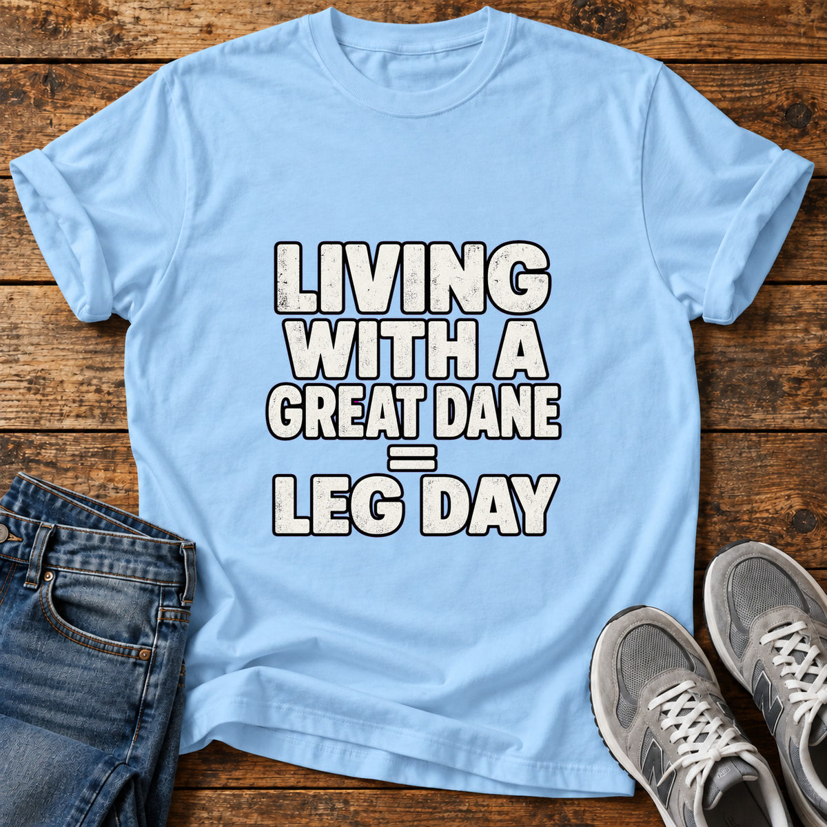 Great Dane Leg graphic T-shirt in Light Blue, shown on a flat-lay shirt mockup