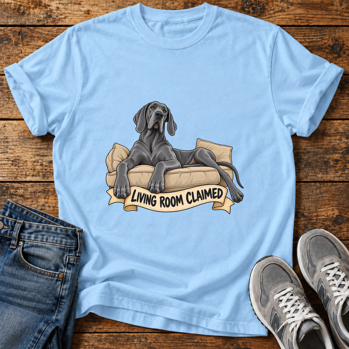Living Room Claimed Great Dane graphic T-shirt in Light Blue, shown on a flat-lay shirt mockup
