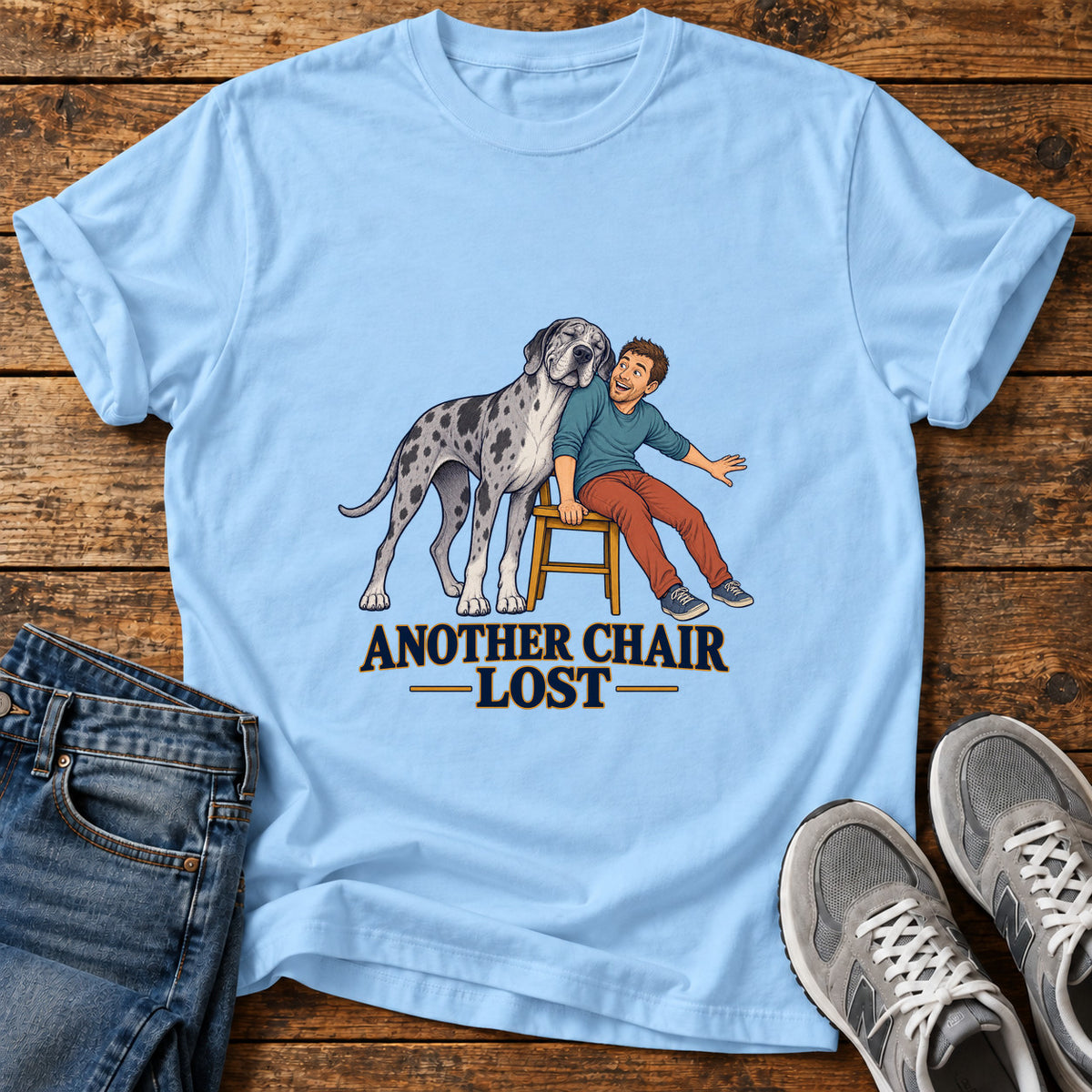 Another Chair Lost Great Dane graphic T-shirt in Light Blue, shown on a flat-lay shirt mockup