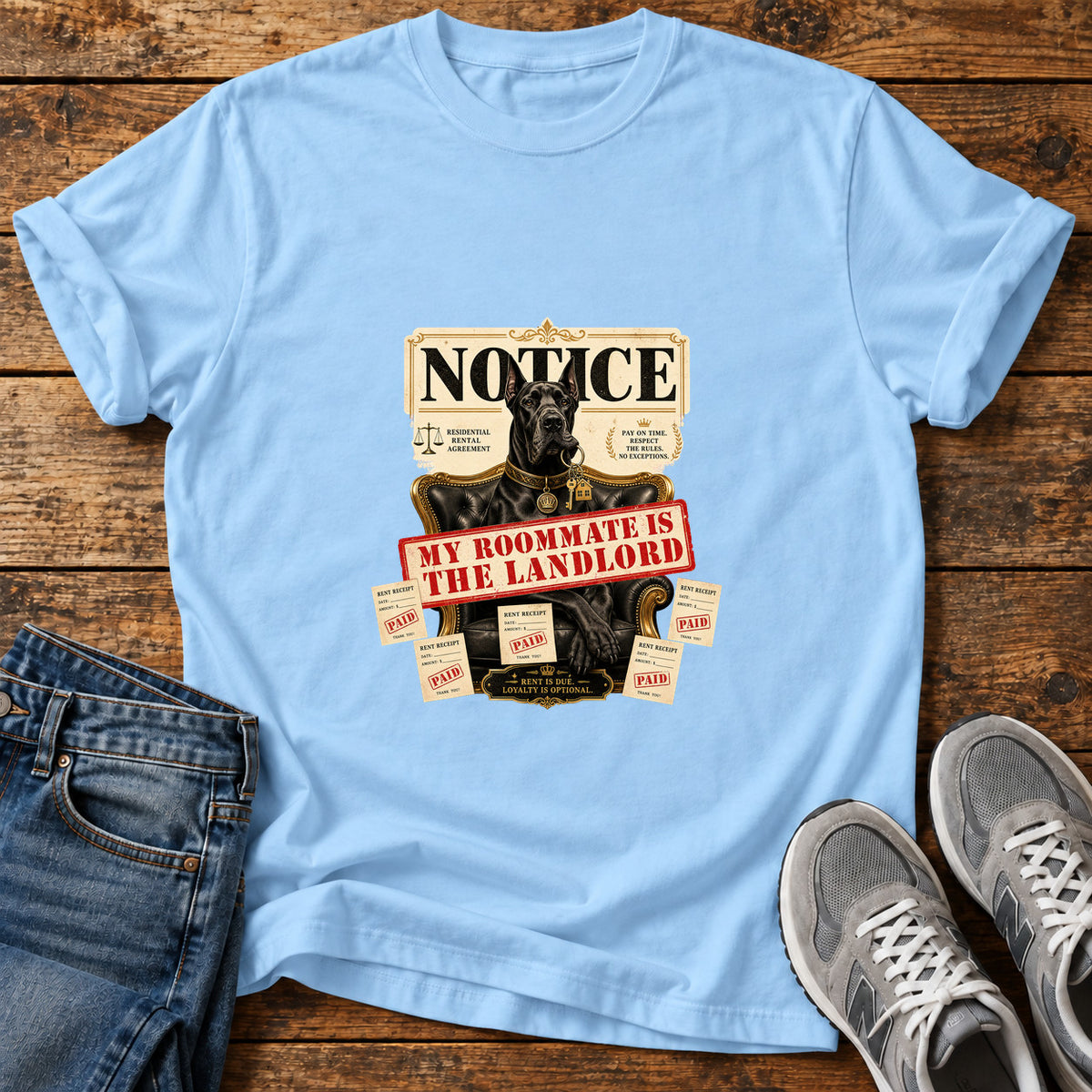 Roommate Landlord Great Dane graphic T-shirt in Light Blue, shown on a flat-lay shirt mockup
