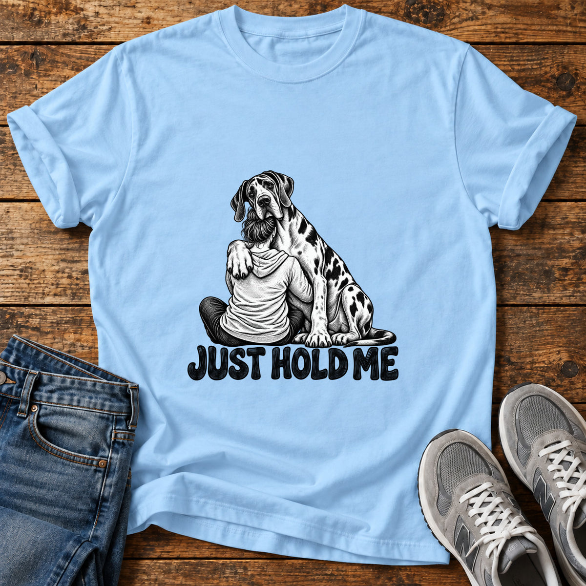 Just Hold Me Great Dane graphic T-shirt in Light Blue, shown on a flat-lay shirt mockup