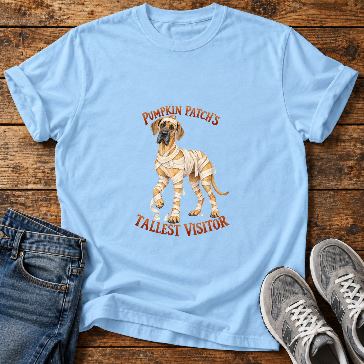 Tallest Visitor Great Dane graphic T-shirt in Light Blue, shown on a flat-lay shirt mockup