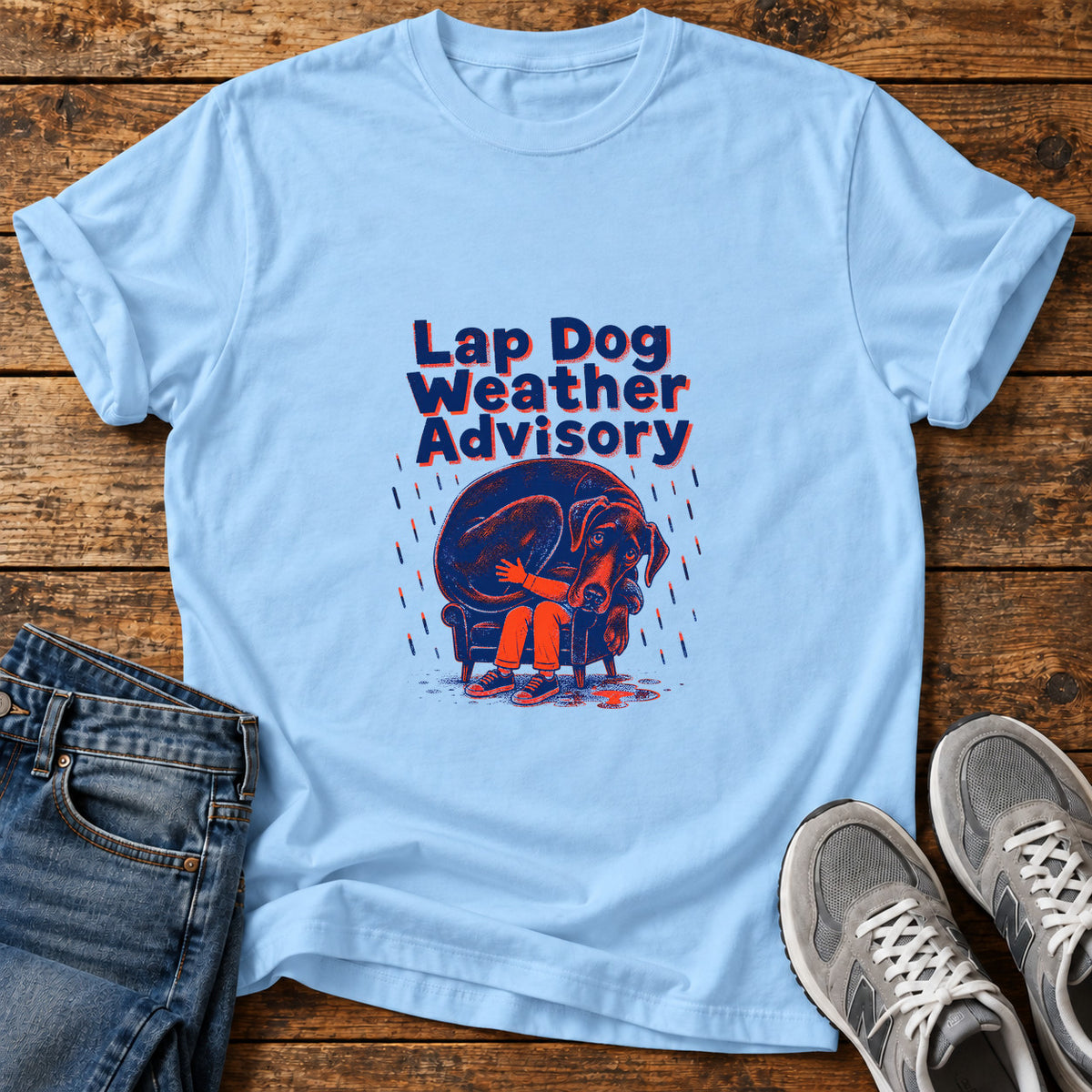 Lap Dog Weather Great Dane graphic T-shirt in Light Blue, shown on a flat-lay shirt mockup