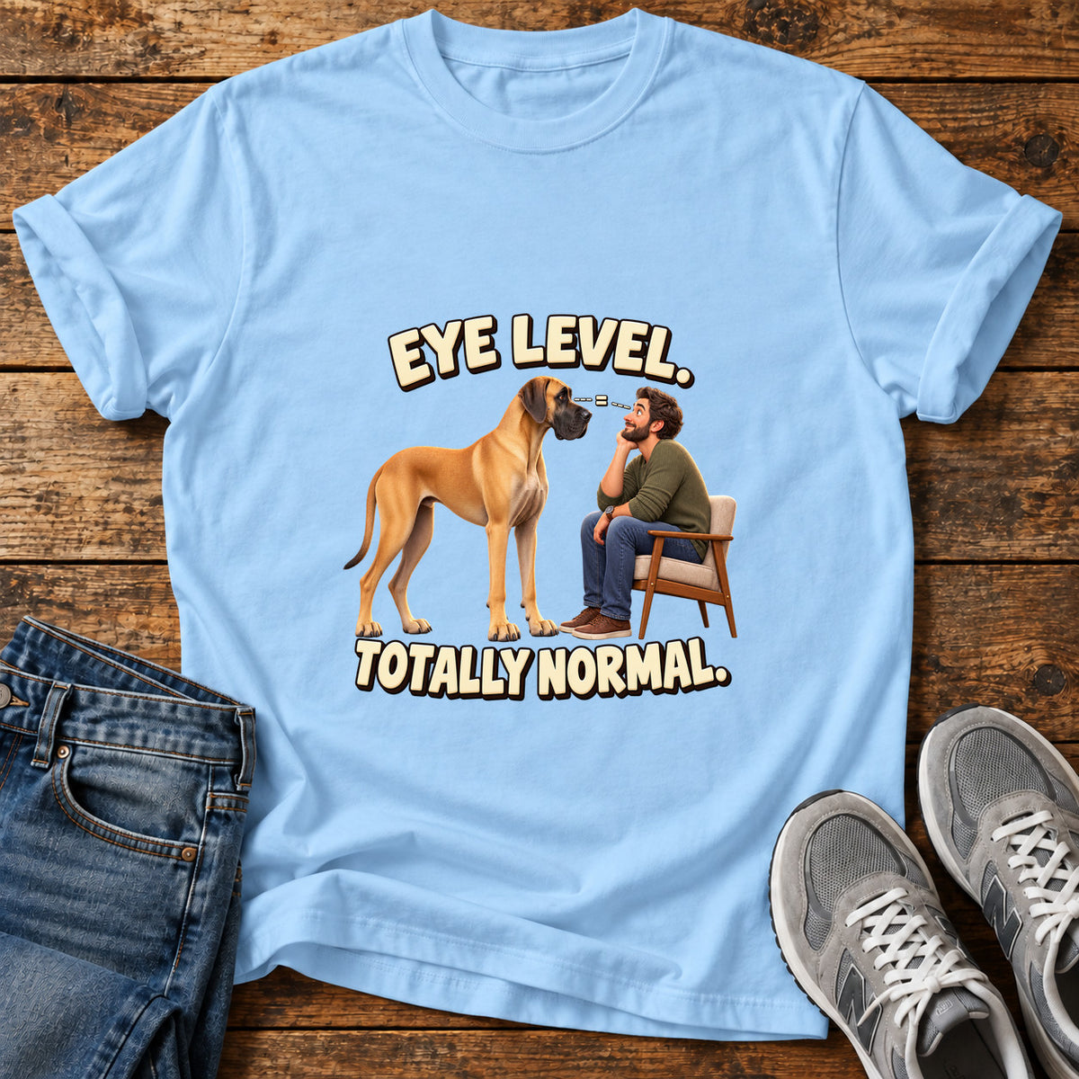 Eye Level Normal Great Dane graphic T-shirt in Light Blue, shown on a flat-lay shirt mockup