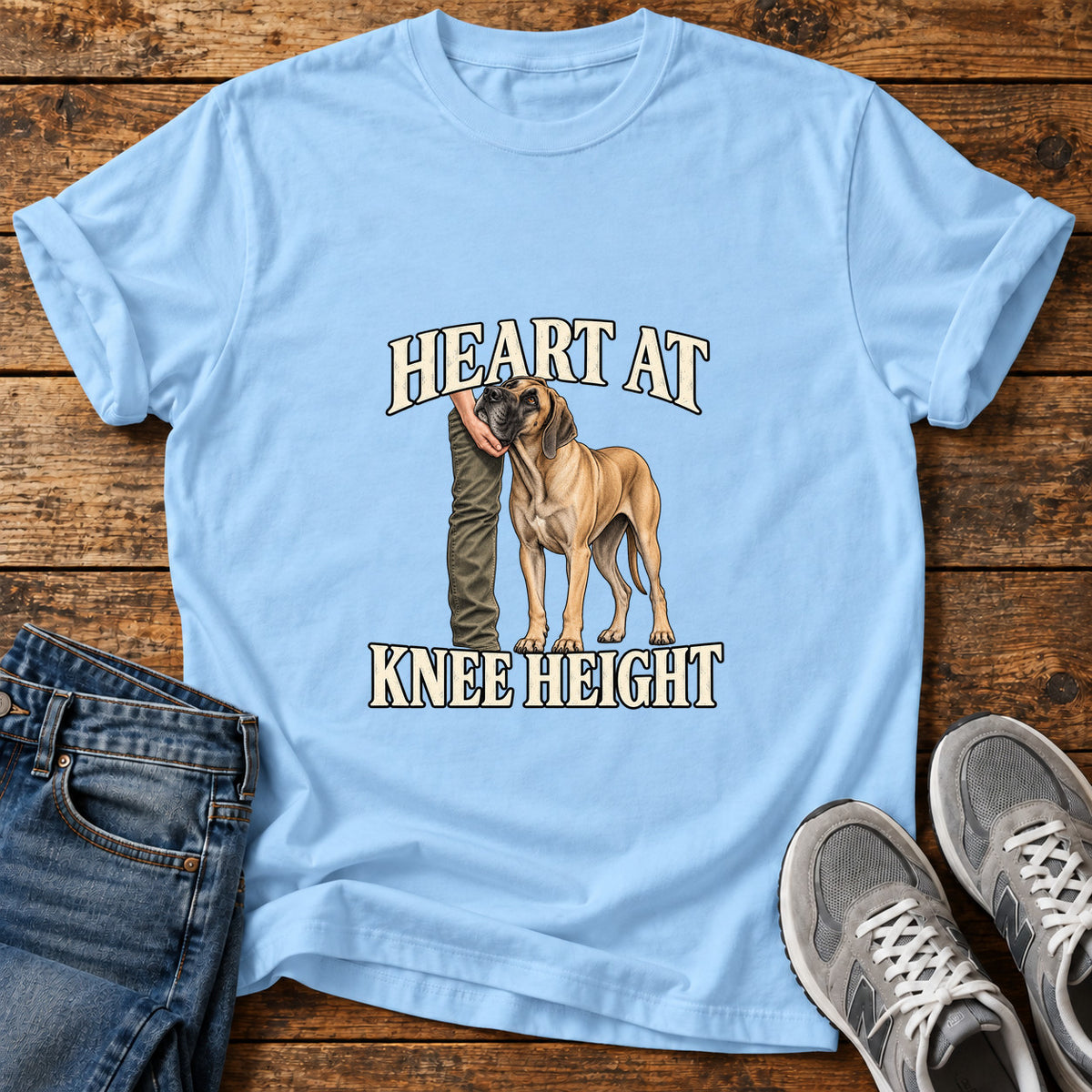 Heart at Knee Great Dane graphic T-shirt in Light Blue, shown on a flat-lay shirt mockup