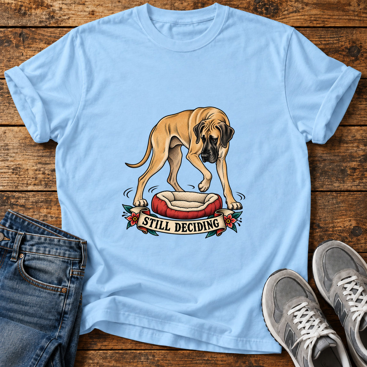 Still Deciding Great Dane graphic T-shirt in Light Blue, shown on a flat-lay shirt mockup