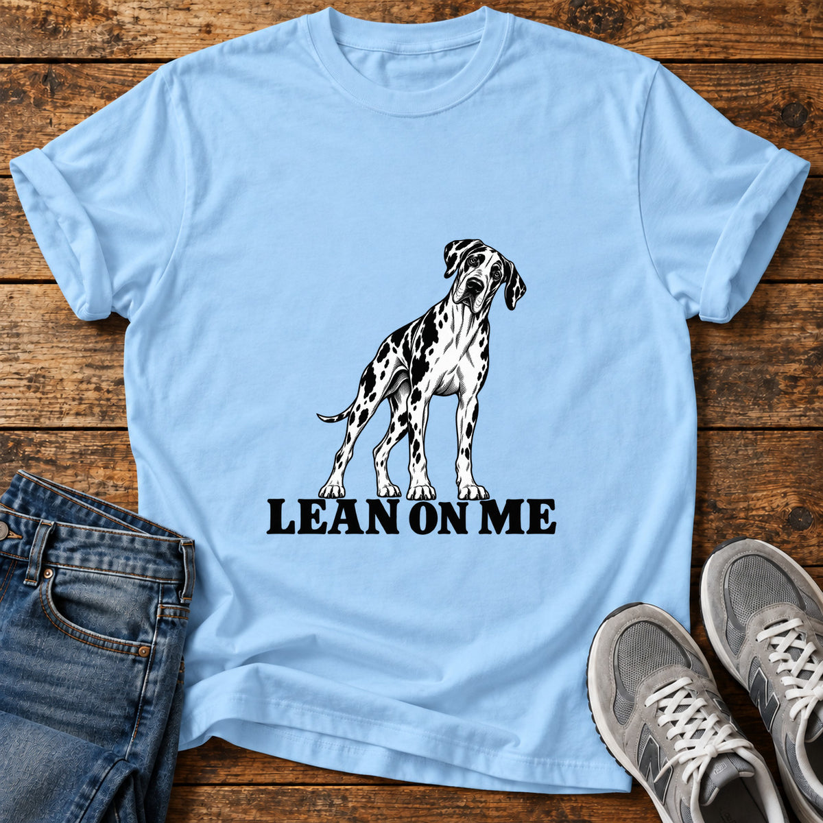 Lean On Me Great Dane graphic T-shirt in Light Blue, shown on a flat-lay shirt mockup