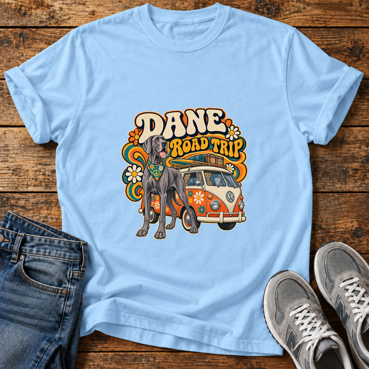 Dane Road Trip Great Dane graphic T-shirt in Light Blue, shown on a flat-lay shirt mockup
