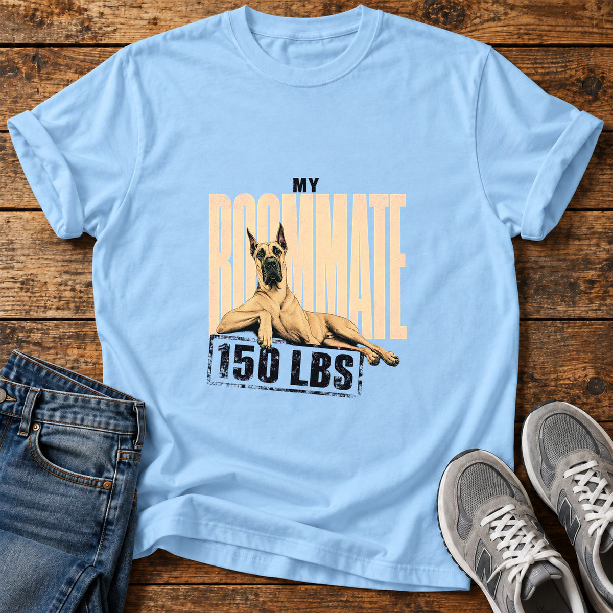 Roommate 150 Lbs Great Dane graphic T-shirt in Light Blue, shown on a flat-lay shirt mockup