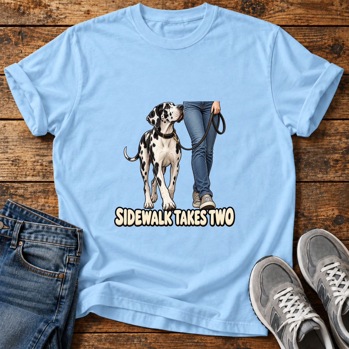 Sidewalk Takes Two Great Dane graphic T-shirt in Light Blue, shown on a flat-lay shirt mockup