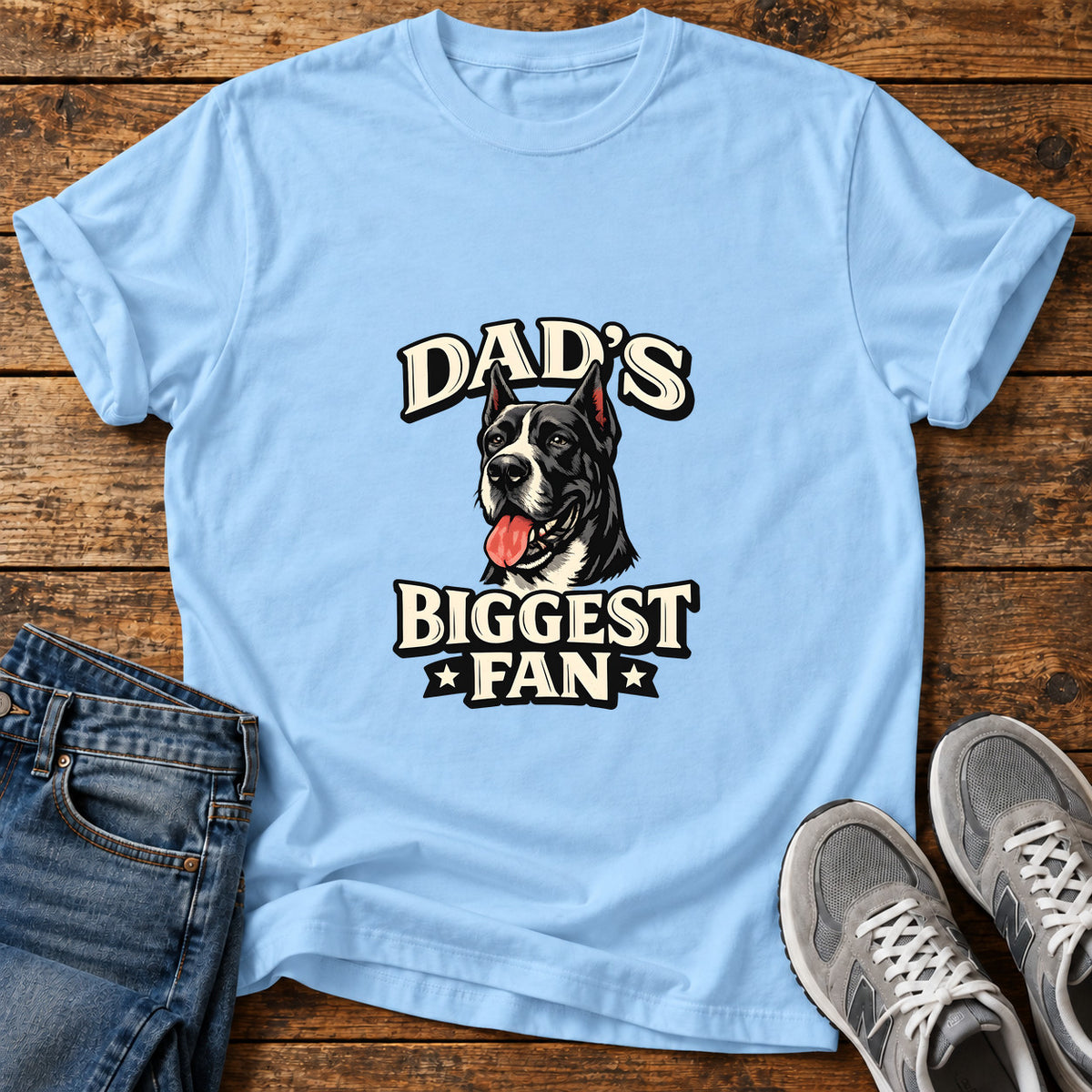 Dad's Biggest Fan Great Dane graphic T-shirt in Light Blue, shown on a flat-lay shirt mockup