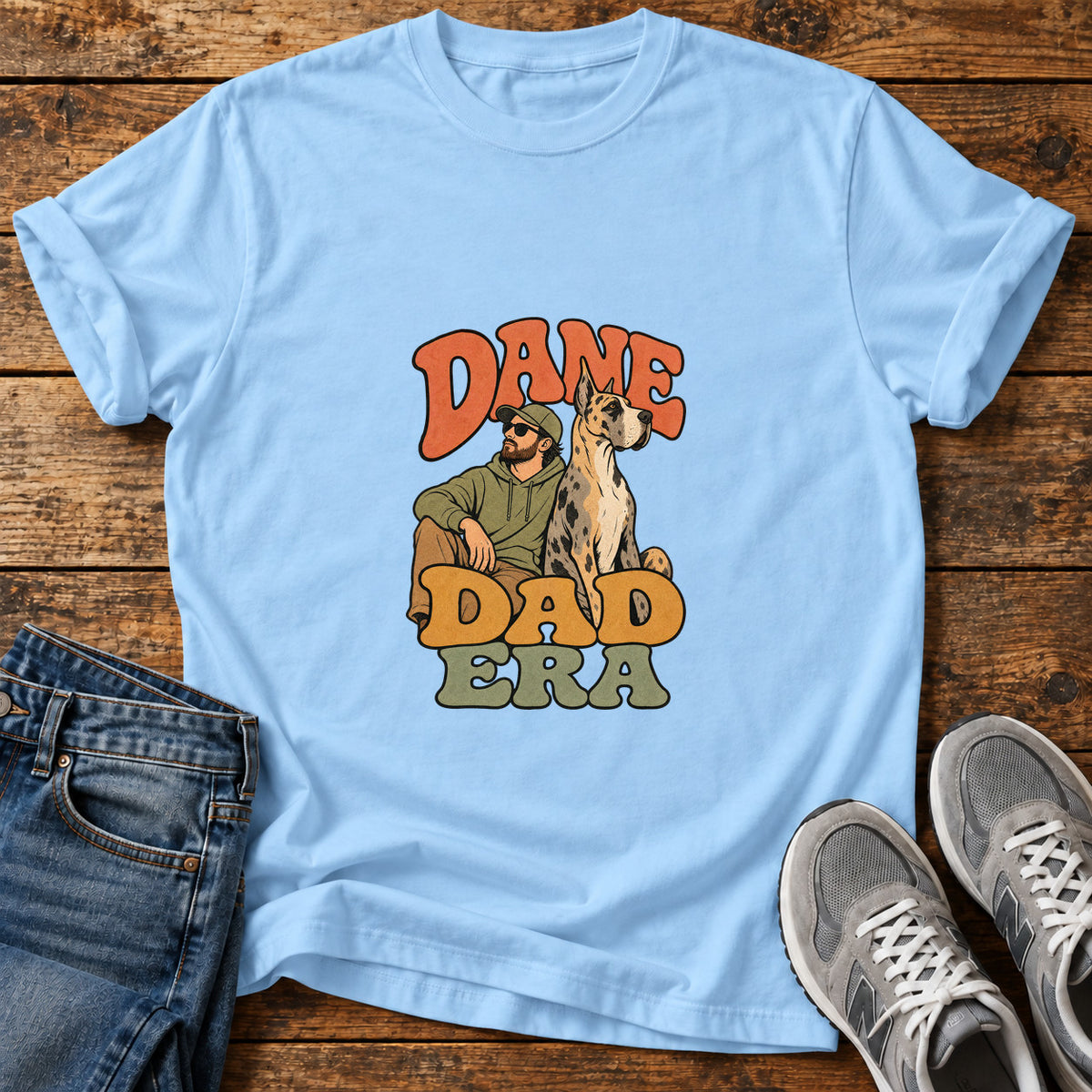 Dane Dad Era Great Dane graphic T-shirt in Light Blue, shown on a flat-lay shirt mockup