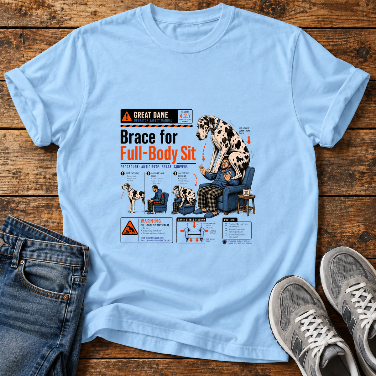 Full-Body Sit Great Dane graphic T-shirt in Light Blue, shown on a flat-lay shirt mockup