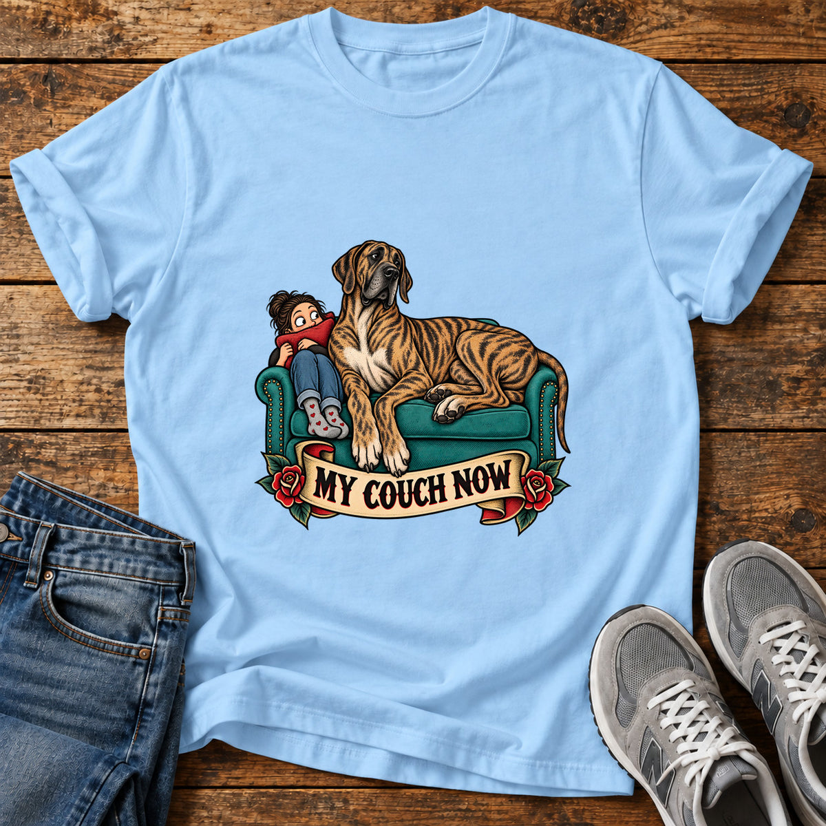 My Couch Now Great Dane graphic T-shirt in Light Blue, shown on a flat-lay shirt mockup