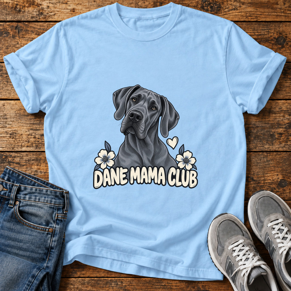 Dane Mama Club Great Dane graphic T-shirt in Light Blue, shown on a flat-lay shirt mockup