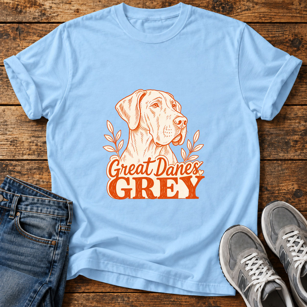 Great Danes Grey graphic T-shirt in Light Blue, shown on a flat-lay shirt mockup
