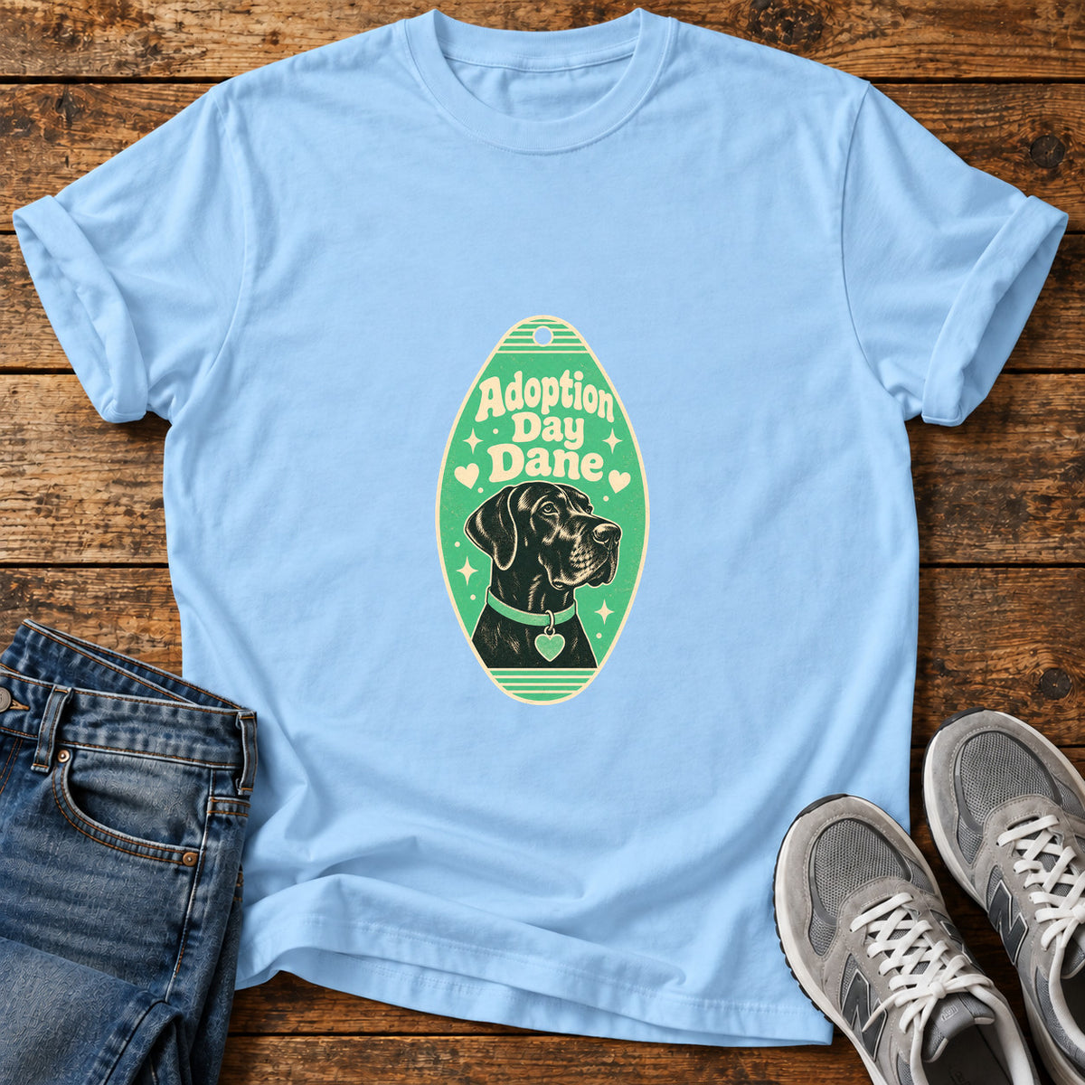 Adoption Day Dane Great Dane graphic T-shirt in Light Blue, shown on a flat-lay shirt mockup