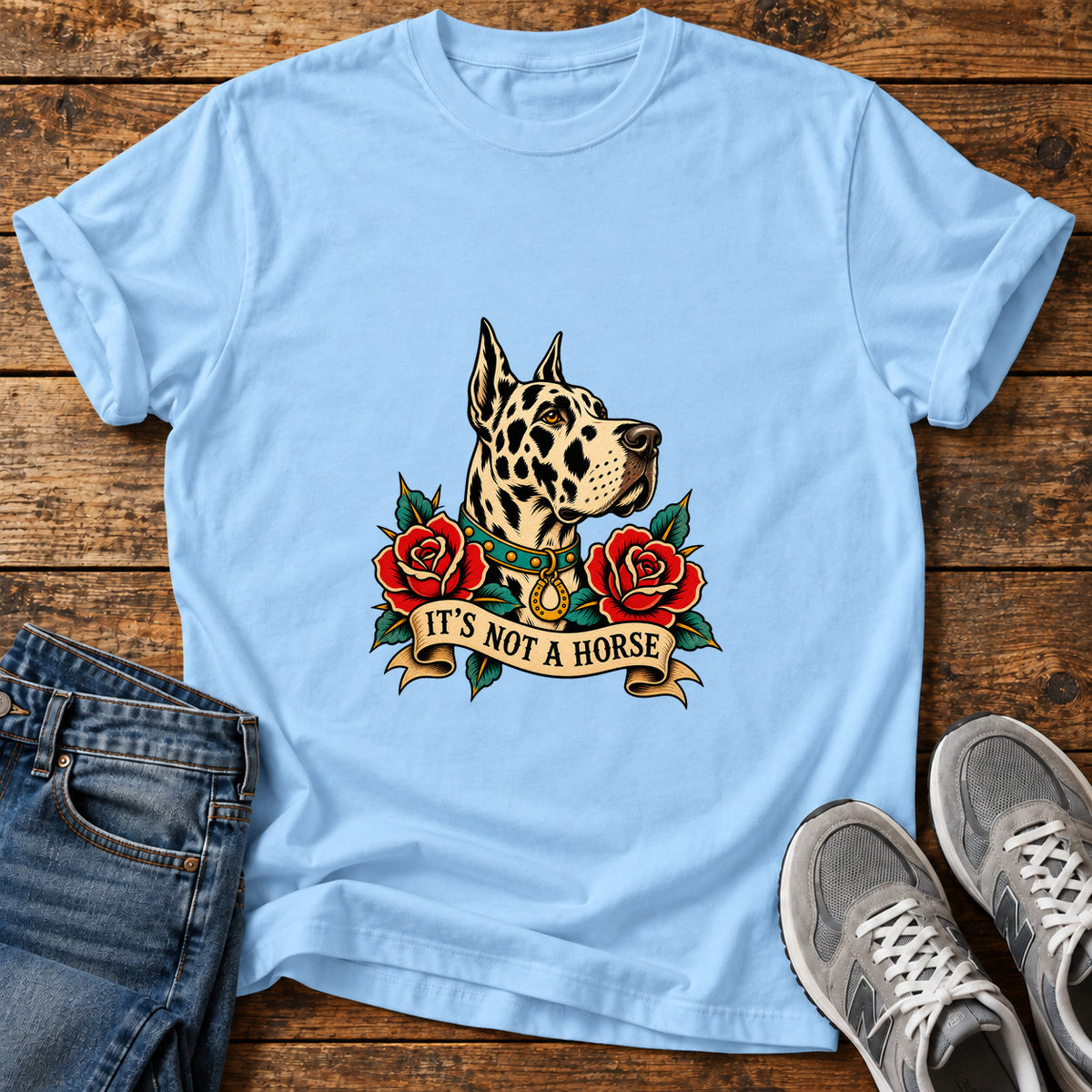 It's Not A Great Dane graphic T-shirt in Light Blue, shown on a flat-lay shirt mockup