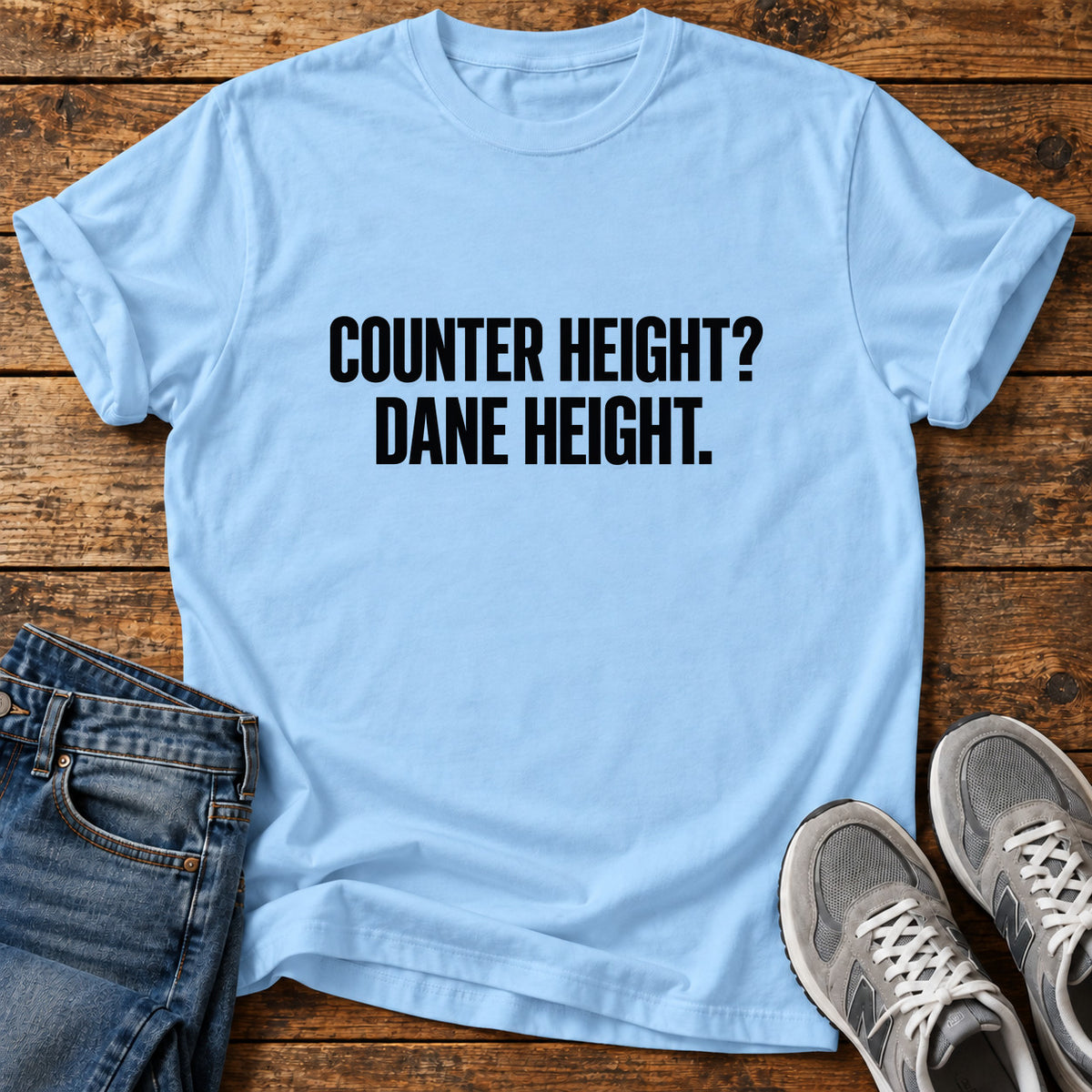 Dane Height Great Dane graphic T-shirt in Light Blue, shown on a flat-lay shirt mockup