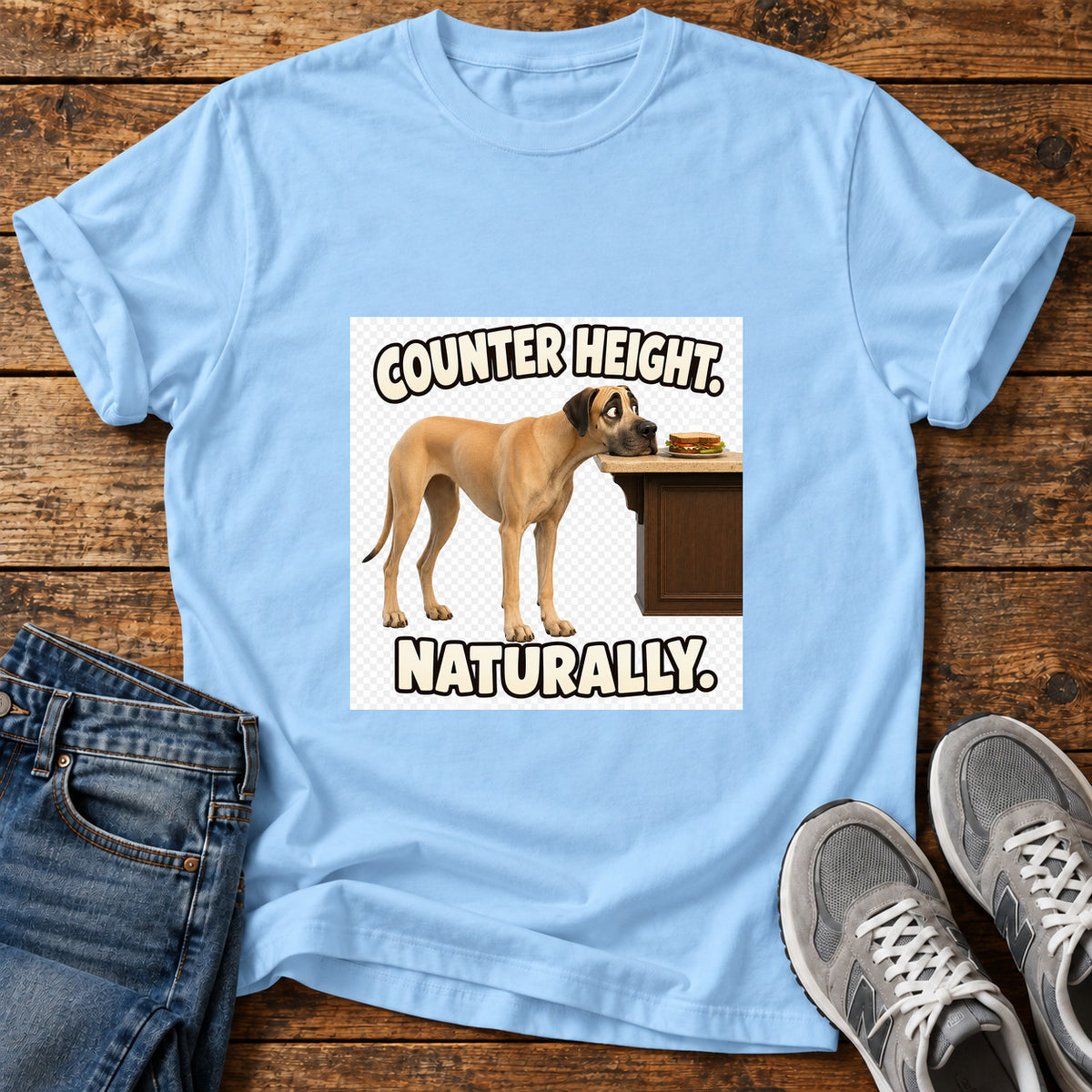 Counter Height Great Dane graphic T-shirt in Light Blue, shown on a flat-lay shirt mockup