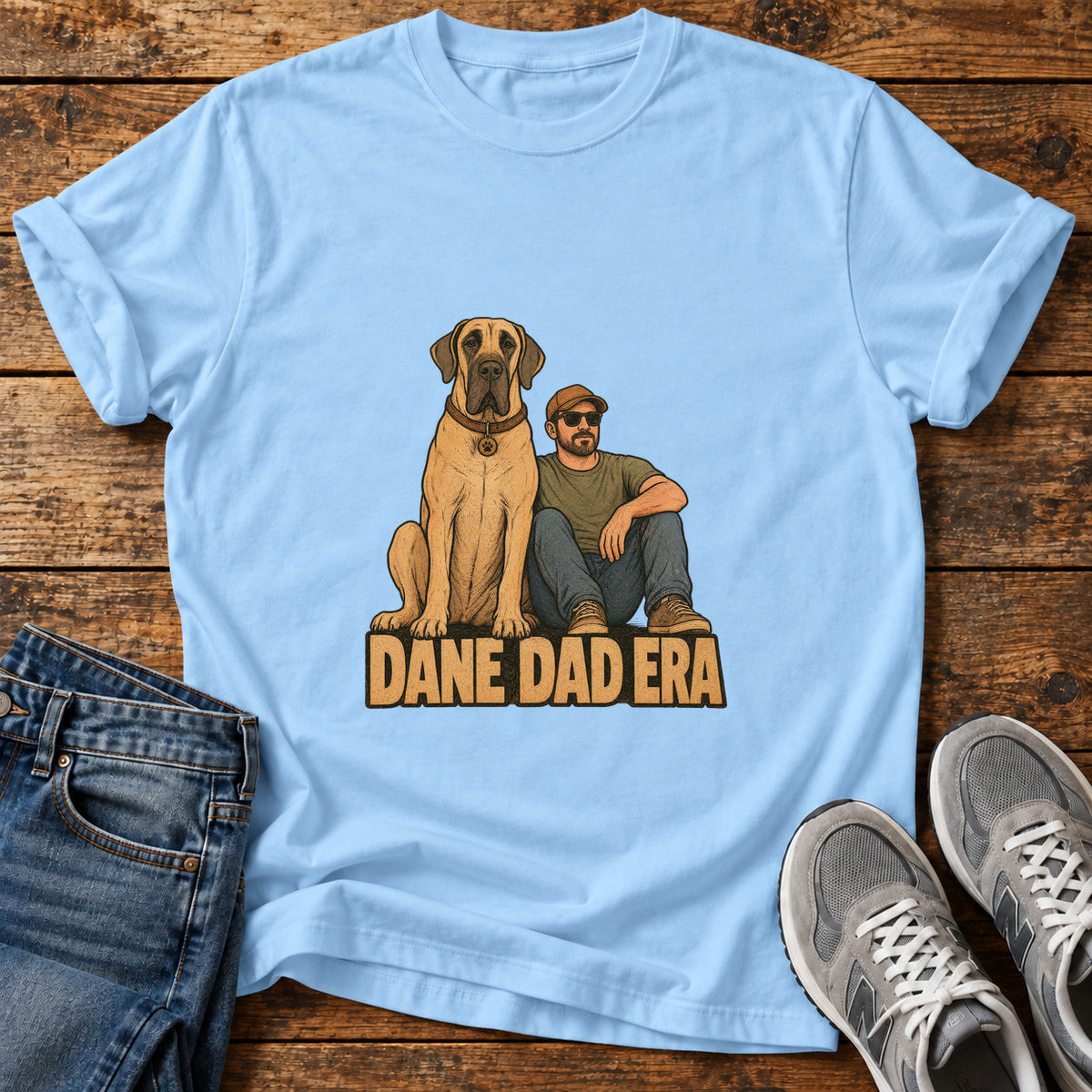 Dane Dad Era Great Dane graphic T-shirt in Light Blue, shown on a flat-lay shirt mockup