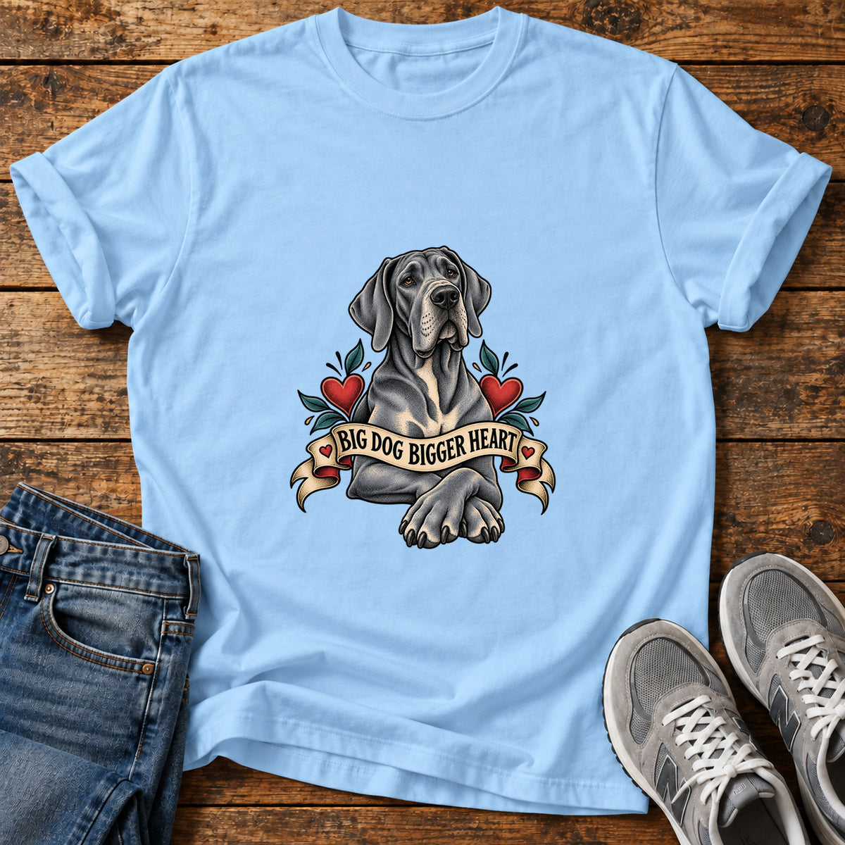 Big Dog Heart Great Dane graphic T-shirt in Light Blue, shown on a flat-lay shirt mockup