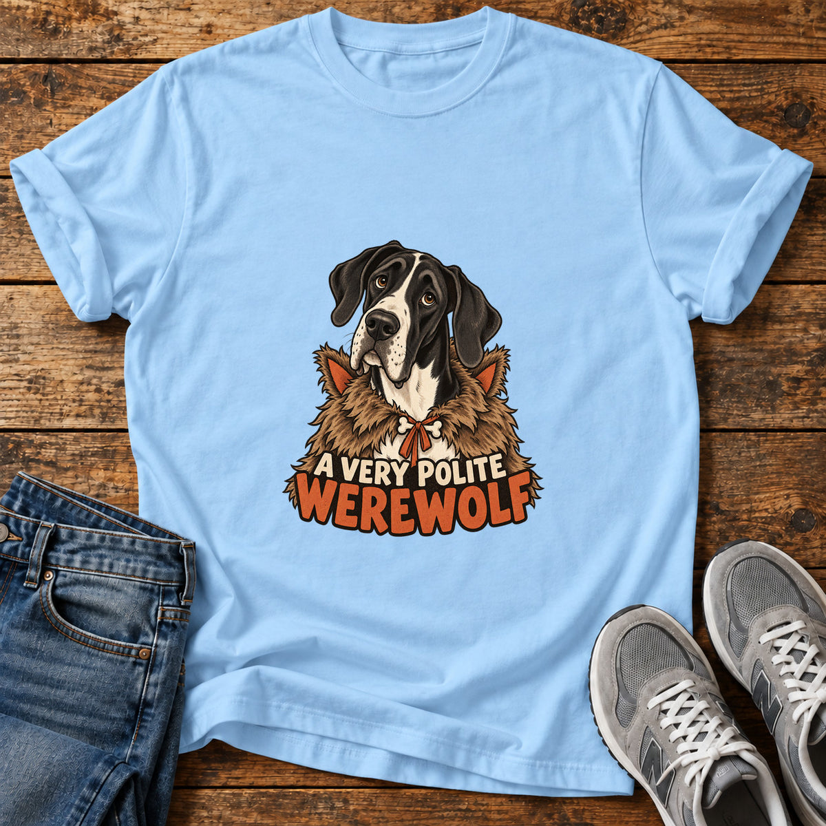 Polite Werewolf Great Dane graphic T-shirt in Light Blue, shown on a flat-lay shirt mockup