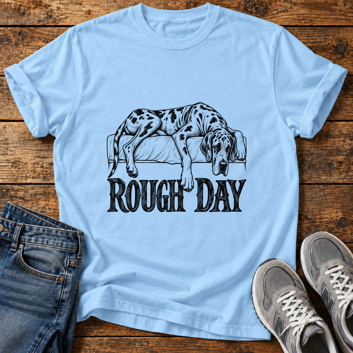 Rough Day Great Dane graphic T-shirt in Light Blue, shown on a flat-lay shirt mockup