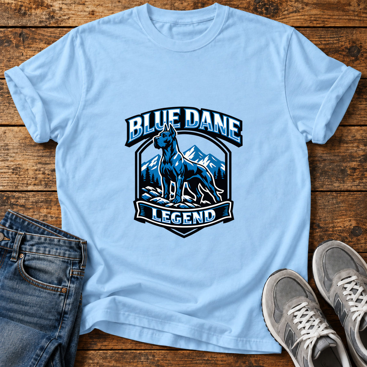 Blue Dane Legend Great Dane graphic T-shirt in Light Blue, shown on a flat-lay shirt mockup